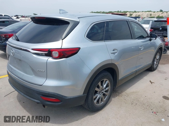 2018 Mazda CX-9 Touring with VIN JM3TCACY5J0219346, listed as a IAAI auction lot 42269310 with 93,989 mi miles and . Bid and sale history available at DreamBid. Image 4.