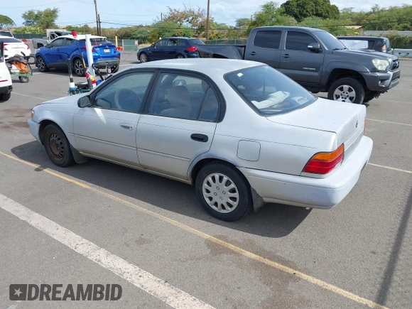 1994 Toyota Corolla Deluxe with VIN JT2AE09B5R0053731, listed as a IAAI auction lot 42606147 with 117,035 mi miles and . Bid and sale history available at DreamBid. Image 3.