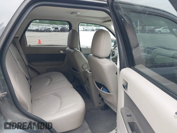 2009 Mercury Mariner Premier z VIN 4M2CU87759KJ17765, wystawiony jako IAAI lot #42354423 z przebiegiem 163 907 mil mil oraz . Historia ofert i sprzedaży dostępna na DreamBid. Obrazek 8.