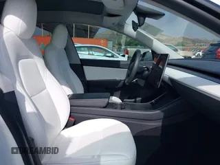 2021 Tesla Model Y Long Range with VIN 5YJYGDEE0MF069451, listed as a IAAI auction lot 41482649 with 55,542 mi miles. Bid and sale history available at carsss.com. Image 5.