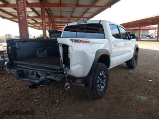 2023 Toyota Tacoma 4WD SR with VIN 3TMCZ5AN8PM650793, listed as a IAAI auction lot 41664712 with 9,427 mi miles. Bid and sale history available at carsss.com. Image 4.