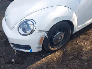 2012 Volkswagen Beetle 2.5L w/Sound/Nav PZEV with VIN 3VWJP7AT1CM619318, listed as a IAAI auction lot 42223291 with 85,989 mi miles and . Bid and sale history available at DreamBid. Image 6.