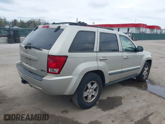 2007 Jeep Grand Cherokee Laredo z VIN 1J8HR48P77C548578, wystawiony jako IAAI lot #41974603 z przebiegiem 179 280 mil mil oraz . Historia ofert i sprzedaży dostępna na DreamBid. Obrazek 4.
