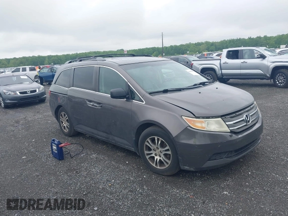 2012 Honda Odyssey EX-L with VIN 5FNRL5H64CB060468, listed as a IAAI auction lot 42182501 with 236,399 mi miles and . Bid and sale history available at carsss.com. Image 1.