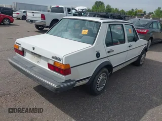 1982 Volkswagen Jetta z VIN WVWGA9161CW521961, wystawiony jako IAAI lot #42373314 z przebiegiem 52 051 mil mil oraz . Historia ofert i sprzedaży dostępna na DreamBid. Obrazek 4.