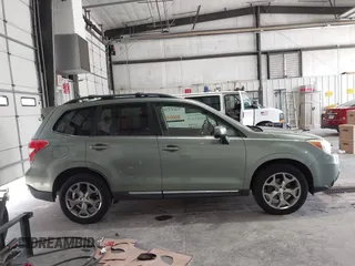 2015 Subaru Forester Touring with VIN JF2SJAUC5FH518262, listed as a IAAI auction lot 42789542 with 182,869 mi miles and . Bid and sale history available at DreamBid. Image 13.