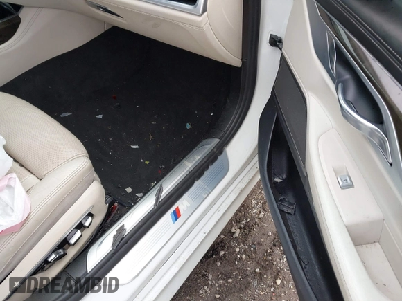 2016 BMW 7 Series 740i with VIN WBA7E2C50GG714647, listed as a IAAI auction lot 41745442 with 134,399 mi miles and . Bid and sale history available at carsss.com. Image 5.