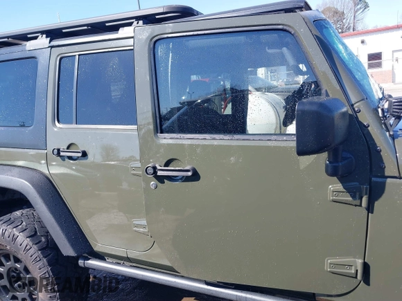 2015 Jeep Wrangler Unlimited Rubicon with VIN 1C4BJWFG0FL623431, listed as a IAAI auction lot 41651317 with 105,508 mi miles. Bid and sale history available at carsss.com. Image 13.