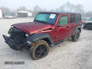 2021 Jeep Wrangler Unlimited Willys with VIN 1C4HJXDN6MW815448, listed as a IAAI auction lot 41459304 with 52,474 mi miles and . Bid and sale history available at DreamBid. Image 2.