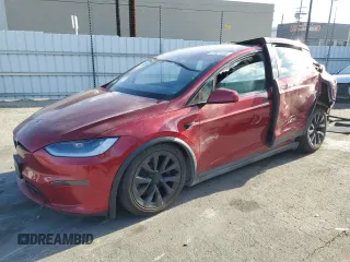 2023 Tesla Model X z VIN 7SAXCAE50PF423076, wystawiony jako Copart lot #87671125 z przebiegiem Nie podano mil oraz Szkoda całkowita • Salvage title. Historia ofert i sprzedaży dostępna na DreamBid. Obrazek 1.