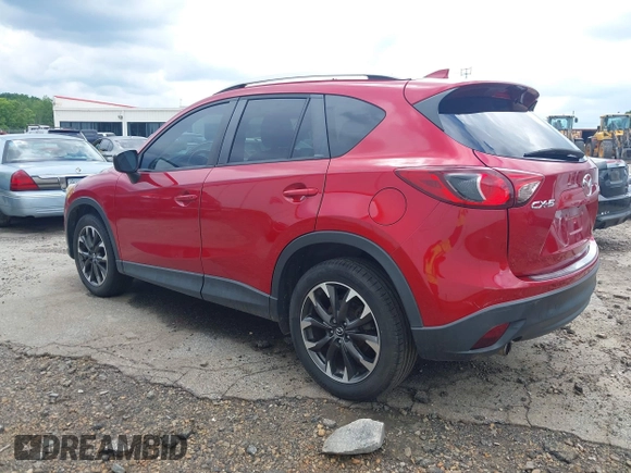 2016 Mazda CX-5 Grand Touring z VIN JM3KE2DY6G0693678, wystawiony jako IAAI lot #42443247 z przebiegiem 127 620 mil mil oraz . Historia ofert i sprzedaży dostępna na DreamBid. Obrazek 3.