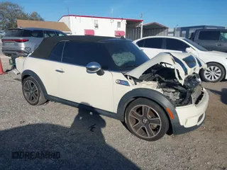 2010 MINI Convertible S with VIN WMWMS3C57ATY08721, listed as a IAAI auction lot 41740378 with 122,880 mi miles and . Bid and sale history available at DreamBid. Image 1.
