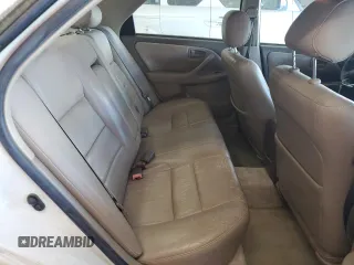 1999 Toyota Camry LE z VIN JT2BG22K3X0317823, wystawiony jako Copart lot #58203965 z przebiegiem 167 587 mil mil oraz Szkoda całkowita • Salvage title. Historia ofert i sprzedaży dostępna na DreamBid. Obrazek 10.