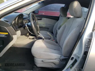 2009 Kia Optima LX z VIN KNAGE228195332931, wystawiony jako Copart lot #55279665 z przebiegiem 295 523 mil mil oraz Szkoda całkowita • Salvage title. Historia ofert i sprzedaży dostępna na DreamBid. Obrazek 7.