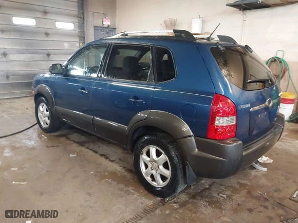 2005 Hyundai Tucson GLS with VIN KM8JN72DX5U076853, listed as a IAAI auction lot 41669853 with 164,241 mi miles. Bid and sale history available at carsss.com. Image 3.