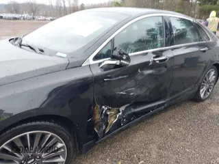 2014 Lincoln MKZ Hybrid with VIN 3LN6L2LU1ER821588, listed as a IAAI auction lot 42017129 with 151,339 mi miles and . Bid and sale history available at carsss.com. Image 16.
