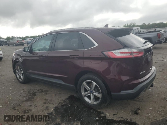 2019 Ford Edge SEL with VIN 2FMPK4J92KBB34891, listed as a Copart auction lot 60050945 with 104,942 mi miles and Salvage title. Bid and sale history available at DreamBid. Image 2.