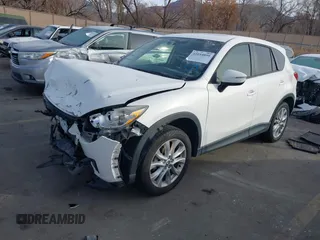 2015 Mazda CX-5 Grand Touring with VIN JM3KE4DY3F0483629, listed as a IAAI auction lot 41054059 with 118,980 mi miles. Bid and sale history available at carsss.com. Image 2.