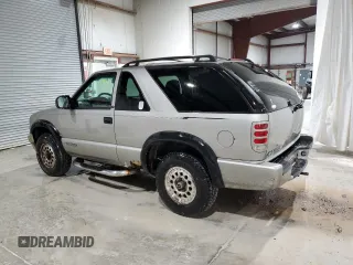 2000 Chevrolet Blazer LS z VIN 1GNCT18W9YK188091, wystawiony jako Copart lot #78592844 z przebiegiem 69 497 mil mil oraz Szkoda całkowita • Salvage title. Historia ofert i sprzedaży dostępna na DreamBid. Obrazek 2.