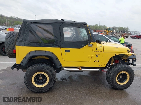 2000 Jeep Wrangler SE with VIN 1J4FA29P5YP705215, listed as a IAAI auction lot 41920532 with 92,927 mi miles and . Bid and sale history available at DreamBid. Image 14.