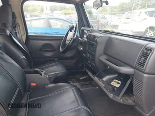 2001 Jeep Wrangler Sport with VIN 1J4FA49S91P330175, listed as a IAAI auction lot 40133432 with 999,999 mi miles. Bid and sale history available at carsss.com. Image 5.