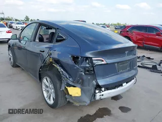 2023 Tesla Model Y Long Range with VIN 7SAYGDEEXPA078629, listed as a IAAI auction lot 42046354 with 27,245 mi miles and . Bid and sale history available at DreamBid. Image 3.