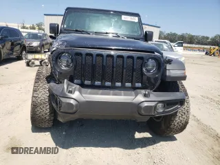 2023 Jeep Wrangler Willys with VIN 1C4HJXDG7PW520719, listed as a Copart auction lot 68978644 with 35,667 mi miles and Clean Title. Bid and sale history available at DreamBid. Image 5.
