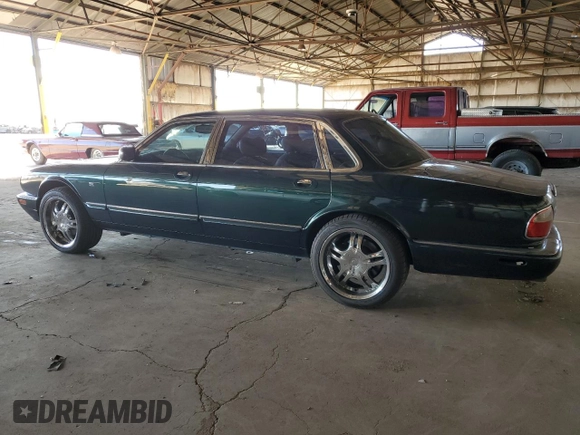 1999 Jaguar XJ with VIN SAJKX6046XC855872, listed as a Copart auction lot 47060465 with 65,286 mi miles and Clean title. Bid and sale history available at DreamBid. Image 2.