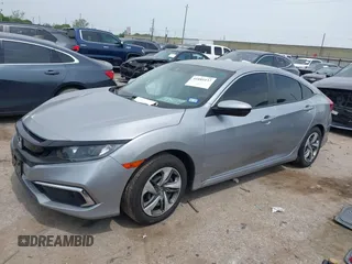 2019 Honda Civic LX with VIN 19XFC2F66KE026931, listed as a IAAI auction lot 41885137 with 55,057 mi miles and . Bid and sale history available at DreamBid. Image 2.