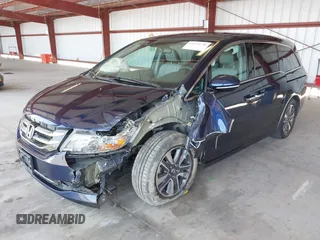 2017 Honda Odyssey Touring with VIN 5FNRL5H90HB017215, listed as a IAAI auction lot 42574528 with 61,386 mi miles and . Bid and sale history available at DreamBid. Image 2.