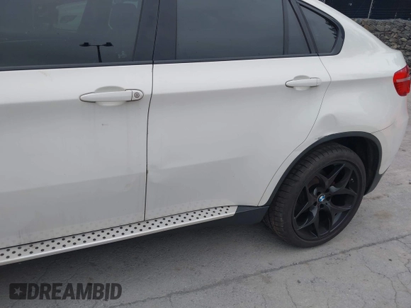 2012 BMW X6 50i z VIN 5UXFG8C53CL590479, wystawiony jako IAAI lot #42021810 z przebiegiem 92 420 mil mil oraz . Historia ofert i sprzedaży dostępna na DreamBid. Obrazek 6.