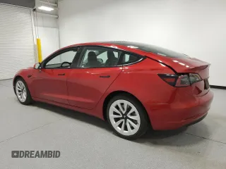 2023 Tesla Model 3 with VIN 5YJ3E1EA6PF455789, listed as a Copart auction lot 54715665 with 64,658 mi miles and Salvage Title. Bid and sale history available at DreamBid. Image 2.