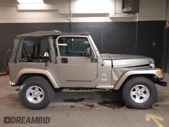2004 Jeep Wrangler Sahara with VIN 1J4FA59S64P736389, listed as a IAAI auction lot 41432819 with 102,830 mi miles and . Bid and sale history available at DreamBid. Image 13.