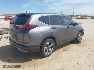 2021 Honda CR-V LX with VIN 5J6RW1H20ML006512, listed as a IAAI auction lot 41811226 with 74,294 mi miles. Bid and sale history available at carsss.com. Image 4.