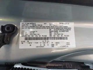 2014 Ford Focus Electric z VIN 1FADP3R41EL238035, wystawiony jako IAAI lot #41975546 z przebiegiem 72 873 mil mil oraz . Historia ofert i sprzedaży dostępna na DreamBid. Obrazek 9.