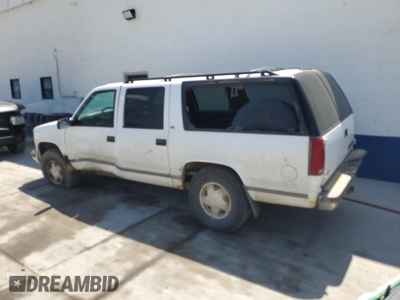 1999 Chevrolet Suburban with VIN 3GNFK16R4XG190883, listed as a Copart auction lot 58324415 with 228,782 mi miles and Salvage title. Bid and sale history available at DreamBid. Image 2.