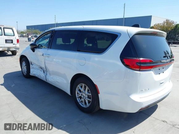 2024 Chrysler Pacifica Touring with VIN 2C4RC1FG7RR194974, listed as a IAAI auction lot 42459547 with 13,200 mi miles and . Bid and sale history available at DreamBid. Image 3.