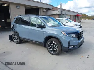2023 Honda Passport Elite with VIN 5FNYF8H03PB000039, listed as a IAAI auction lot 40593339 with 33,697 mi miles and . Bid and sale history available at DreamBid. Image 1.