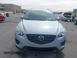 2016 Mazda CX-5 Grand Touring with VIN JM3KE2DY9G0723921, listed as a IAAI auction lot 41681522 with 83,893 mi miles. Bid and sale history available at carsss.com. Image 12.