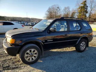 1998 Honda Passport LX with VIN 4S6CM58W7W4419247, listed as a Copart auction lot 88231175 with 194,105 mi miles and Salvage Title. Bid and sale history available at carsss.com. Image 1.