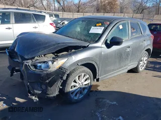 2014 Mazda CX-5 Grand Touring with VIN JM3KE2DY1E0421326, listed as a IAAI auction lot 41330794 with 127,589 mi miles. Bid and sale history available at carsss.com. Image 17.