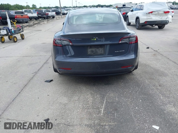 2021 Tesla Model 3 Long Range with VIN 5YJ3E1EB4MF855581, listed as a IAAI auction lot 41974515 with 71,561 mi miles. Bid and sale history available at carsss.com. Image 16.