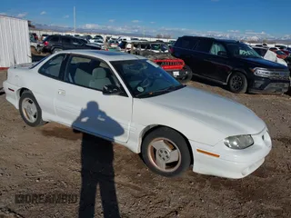 1996 Pontiac Grand Am z VIN 1G2NW12T1TC804543, wystawiony jako IAAI lot #41590581 z przebiegiem 118 158 mil mil oraz . Historia ofert i sprzedaży dostępna na DreamBid. Obrazek 1.