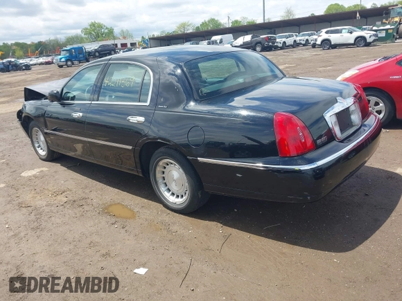 2001 Lincoln Town Car Executive z VIN 1LNHM81W21Y703011, wystawiony jako IAAI lot #42211369 z przebiegiem 188 000 mil mil oraz . Historia ofert i sprzedaży dostępna na DreamBid. Obrazek 3.