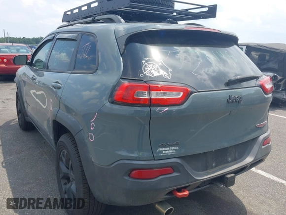 2015 Jeep Cherokee Trailhawk with VIN 1C4PJMBB0FW528421, listed as a IAAI auction lot 42591132 with 166,425 mi miles and . Bid and sale history available at DreamBid. Image 3.