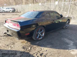 2013 Dodge Challenger SXT with VIN 2C3CDYAG5DH520017, listed as a IAAI auction lot 41882517 with 128,854 mi miles. Bid and sale history available at carsss.com. Image 4.