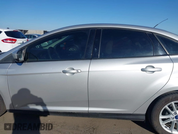2018 Ford Focus SE z VIN 1FADP3F27JL204873, wystawiony jako IAAI lot #41657504 z przebiegiem 99 224 mil mil oraz . Historia ofert i sprzedaży dostępna na DreamBid. Obrazek 14.