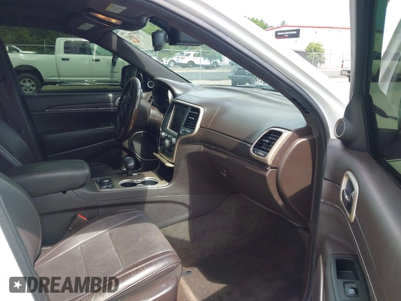 2014 Jeep Grand Cherokee Summit with VIN 1C4RJFJT6EC281114, listed as a IAAI auction lot 42497582 with 128,181 mi miles and . Bid and sale history available at DreamBid. Image 5.