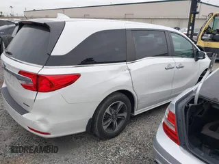 2020 Honda Odyssey Touring with VIN 5FNRL6H81LB028083, listed as a IAAI auction lot 42003810 with 71,536 mi miles and . Bid and sale history available at DreamBid. Image 4.