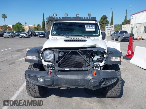 2022 Jeep Gladiator Mojave z VIN 1C6JJTEG0NL103523, wystawiony jako IAAI lot #41842011 z przebiegiem 36 160 mil mil oraz . Historia ofert i sprzedaży dostępna na DreamBid. Obrazek 13.